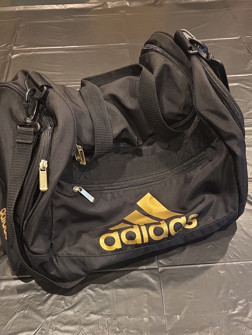 adidas Black and Gold Logo Duffel Bag